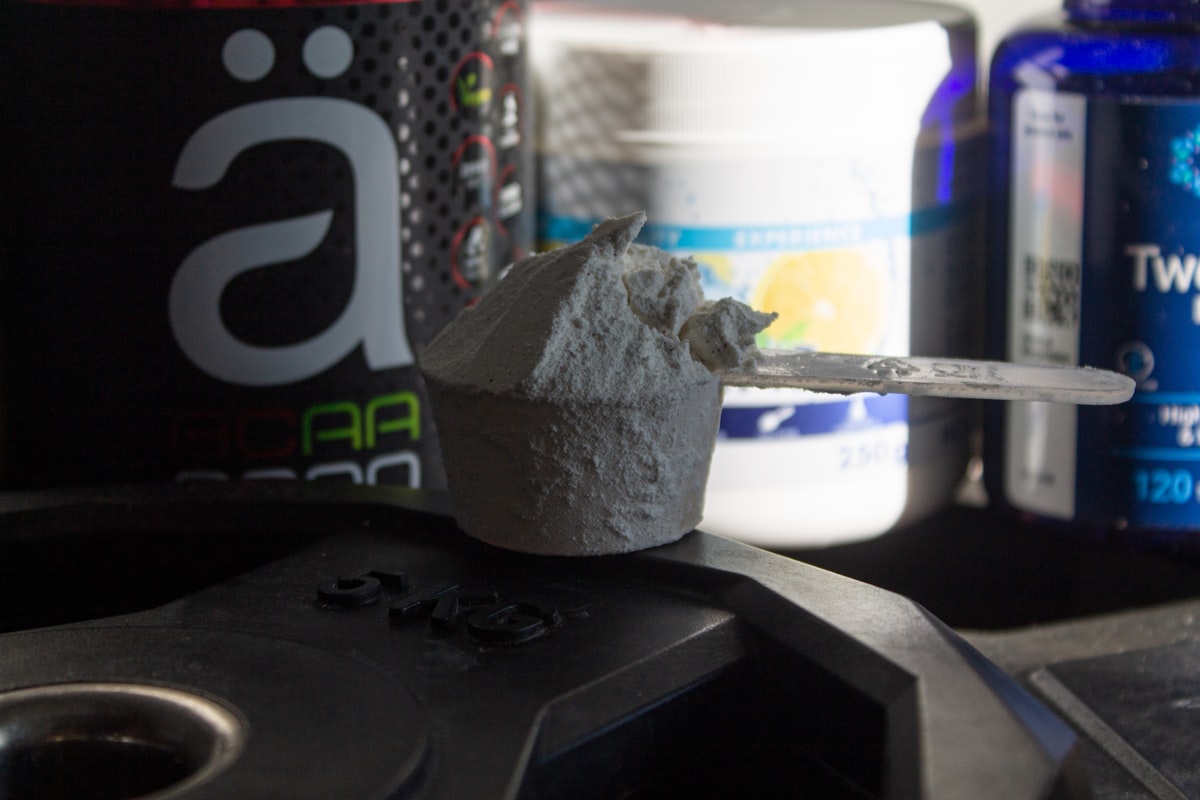 Athlete training with pre-workout supplements